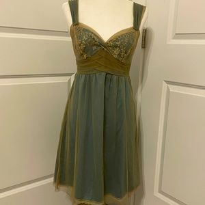 Left of Center Vintage Anthropologie
Worn Three Times

Teal/Gold Dress. 
Size 4.